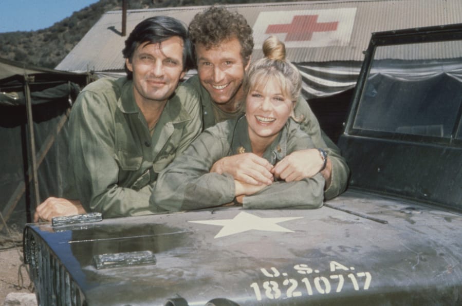 Alan Alda, from left, with Wayne Rogers and Loretta Swit on &quot;M*A*S*H.&quot; (Tribune News Service)