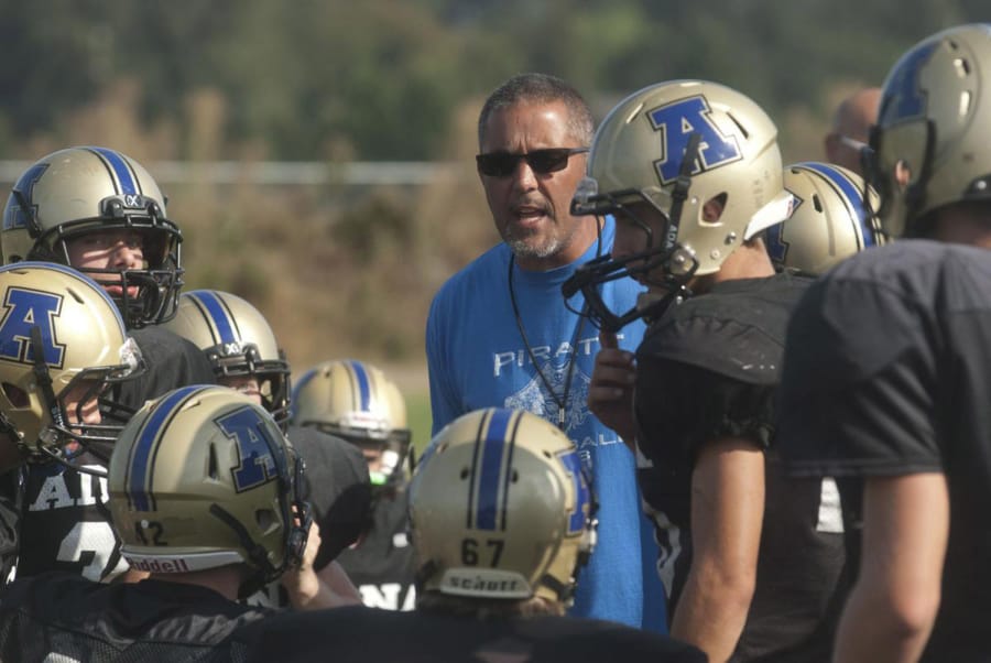 Adna football coach KC Johnson talks to his team during a preseason scrimmage in 2015. Johnson was a senior quarterback at Toledo High in 1983, when Toledo and Ridgefield played seven overtimes to set a state record.