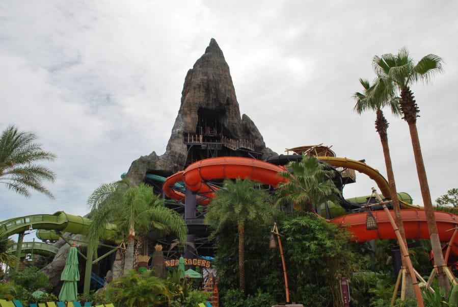 Guests ride slides down four lanes through underwater sea caves on Punga Racers, an attraction at Universal&#039;s Volcano Bay.