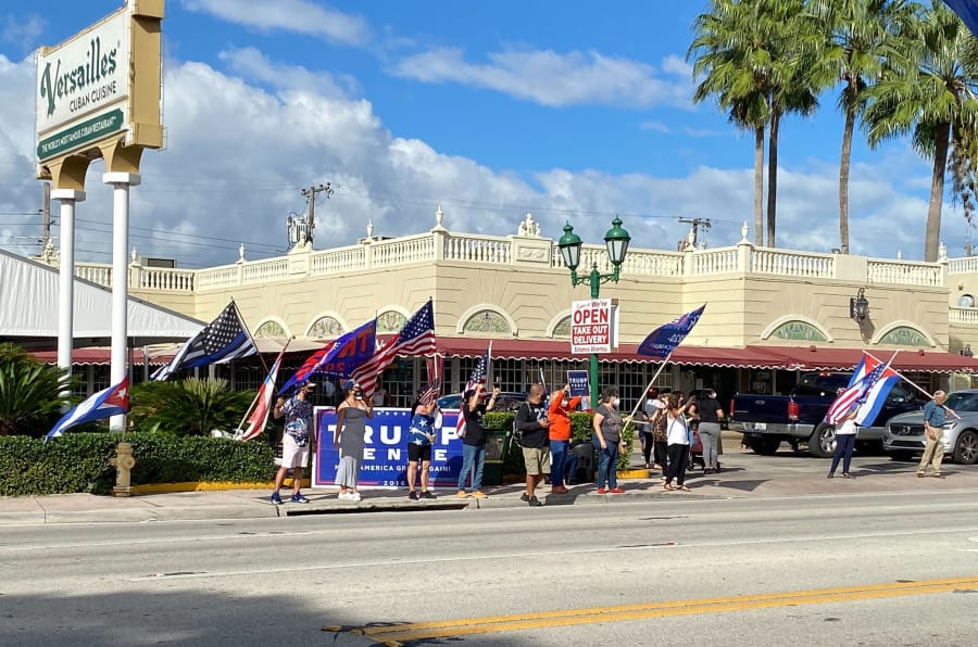A group gathers at a Joe Biden caravan on Oct. 18, 2020 in Miami, Florida. A group of Donald Trump supporters gathered outside of Versailles and both sides shouted at one another.