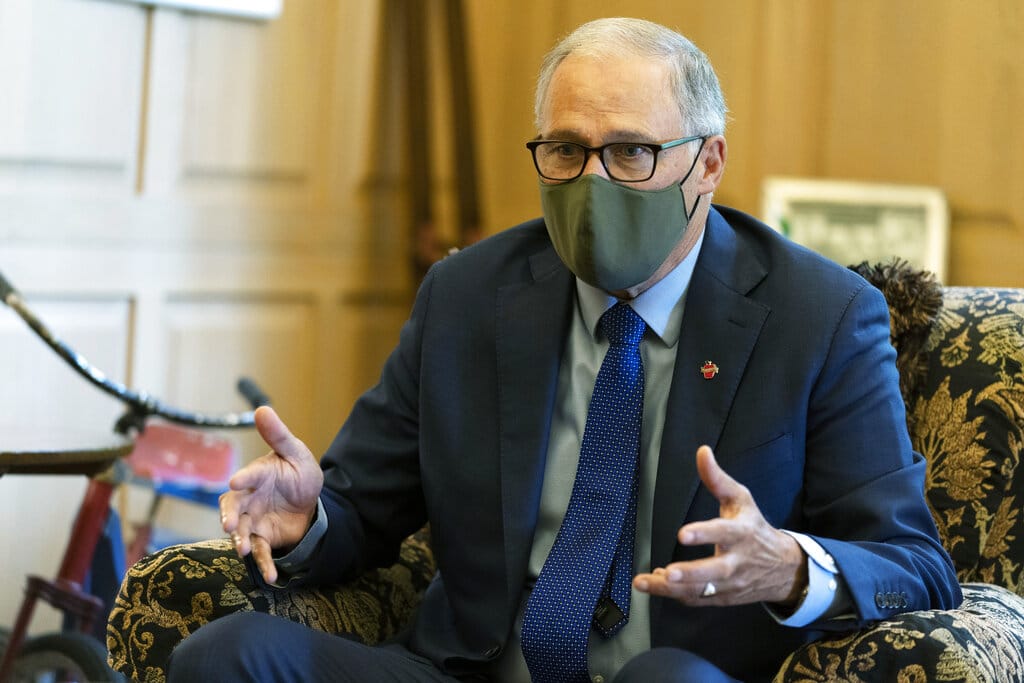 Washington Gov. Jay Inslee takes part in an AP interview, Friday, Sept. 25, 2020, at the Governor's Mansion in Olympia, Wash. Inslee, a Democrat, is being challenged by Republican Loren Culp, police chief of the small town of Republic, Wash., in the Nov. 3 election. (AP Photo/Ted S.