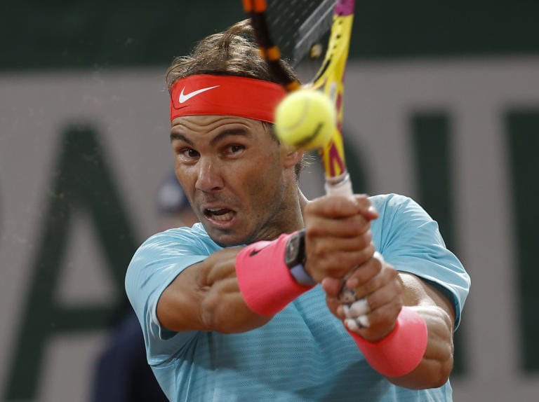Spain's Rafael Nadal plays a shot against Serbia's Novak Djokovic in the final match of the French Open tennis tournament at the Roland Garros stadium in Paris, France, Sunday, Oct. 11, 2020.