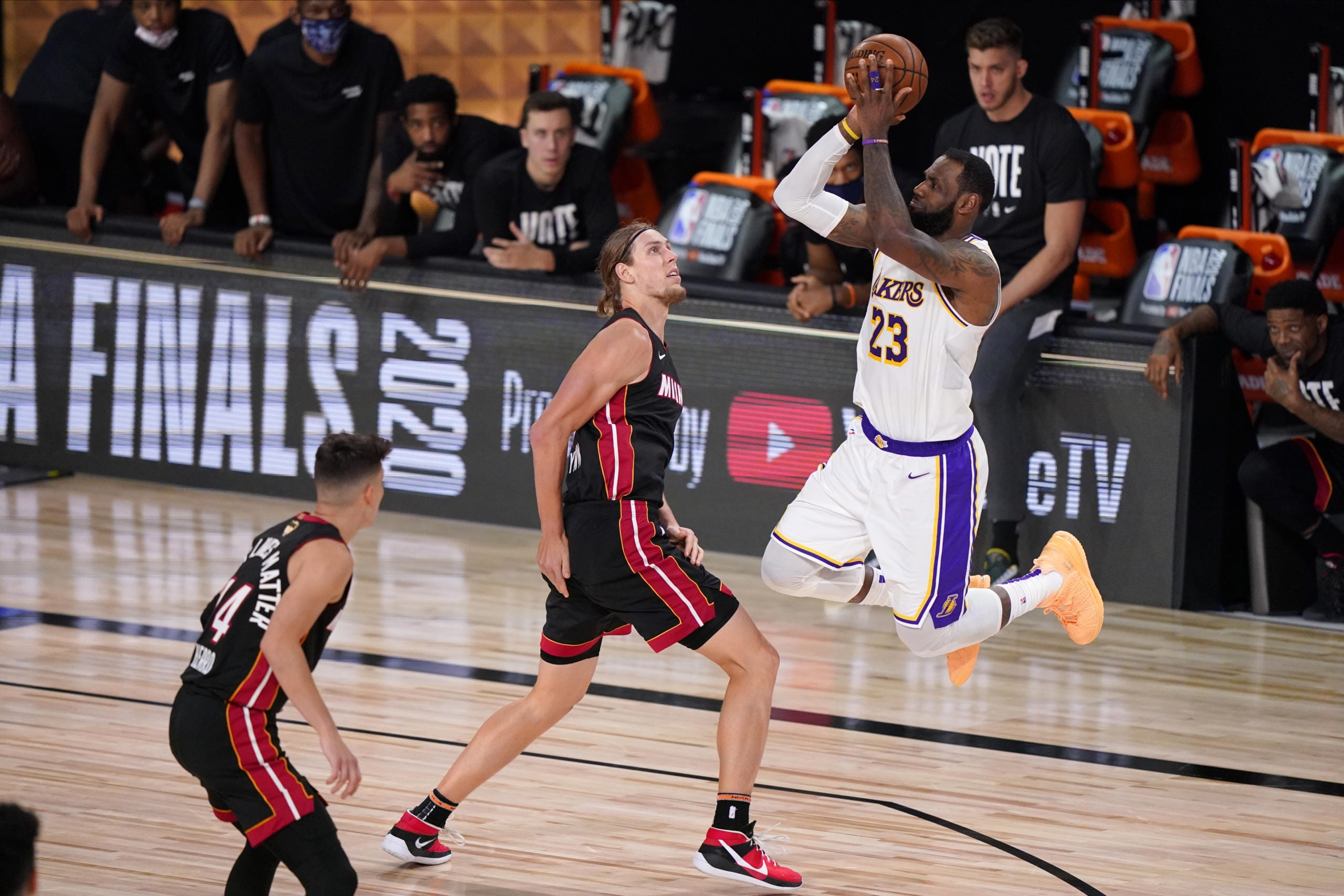 Los Angeles Lakers' LeBron James (23) takes a shot over Miami Heat's Kelly Olynyk (9) during the second half in Game 6 of basketball's NBA Finals Sunday, Oct. 11, 2020, in Lake Buena Vista, Fla. (AP Photo/Mark J.