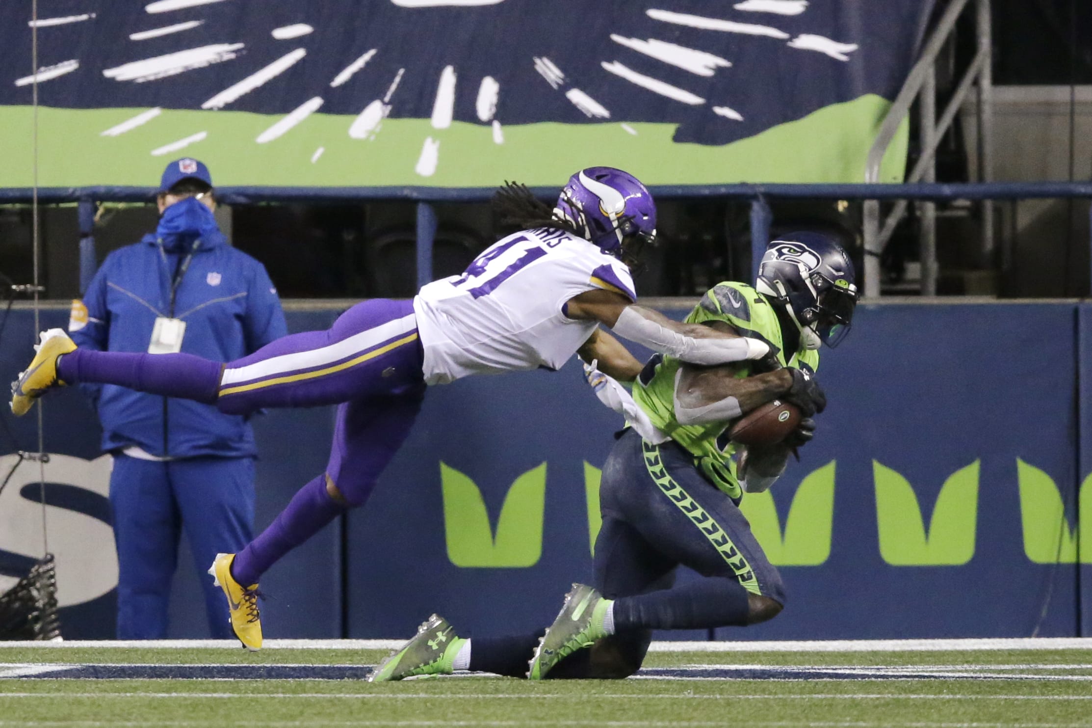 Seattle Seahawks' DK Metcalf, right, catches the ball in the end zone for a touchdown as Minnesota Vikings' Anthony Harris defends near the end of the second half of an NFL football game, Sunday, Oct. 11, 2020, in Seattle.