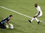Portland Timbers goalkeeper Steve Clark, left, stops the shot of Los Angeles FC forward Bradley Wright-Phillips, right, during the first half of an MLS soccer match in Portland, Ore., Sunday, Oct. 18, 2020.