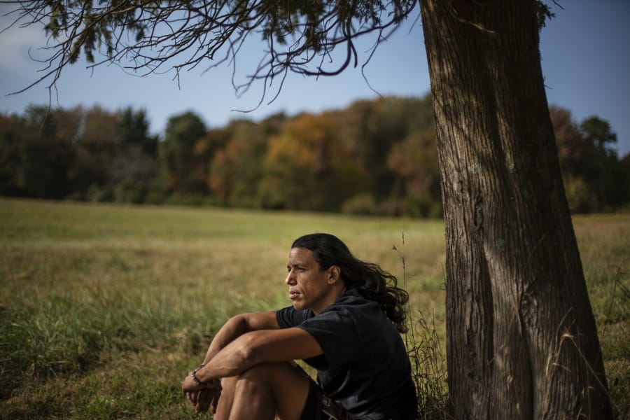 Annawon Weeden, 46, a member of the Mashpee Wampanoag Tribe, sits for a portrait outside his home in Oakdale, Conn., Friday, Sept. 25, 2020. &quot;How do you pay somebody for that?&quot; said Weeden when asked if governments should make financial reparations to Native people. &quot;The most valuable thing anyone can have or possess ever is time and you don&#039;t get that time back. I don&#039;t get my ancestors back. It&#039;s degrading to think that you could buy your way out of what you put us in. Actions speak for themselves,&quot; Weeden said. &quot;You don&#039;t got to pay me a dime. Clean up your community, show some respect. Pay the land the respect. It&#039;s never about me. It&#039;s about this land. I&#039;m only here for a short time. This land had to last a lot longer. Your children are going to have to inherit this. What do you want to leave them?