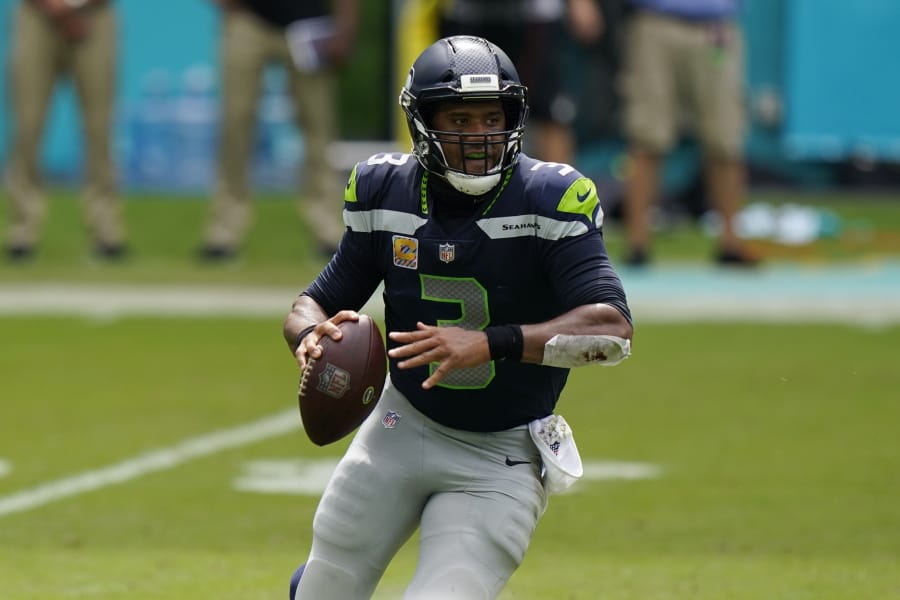Seattle Seahawks quarterback Russell Wilson (3) looks to pass the ball during the first half of an NFL football game against the Miami Dolphins, Sunday, Oct. 4, 2020 in Miami Gardens, Fla.