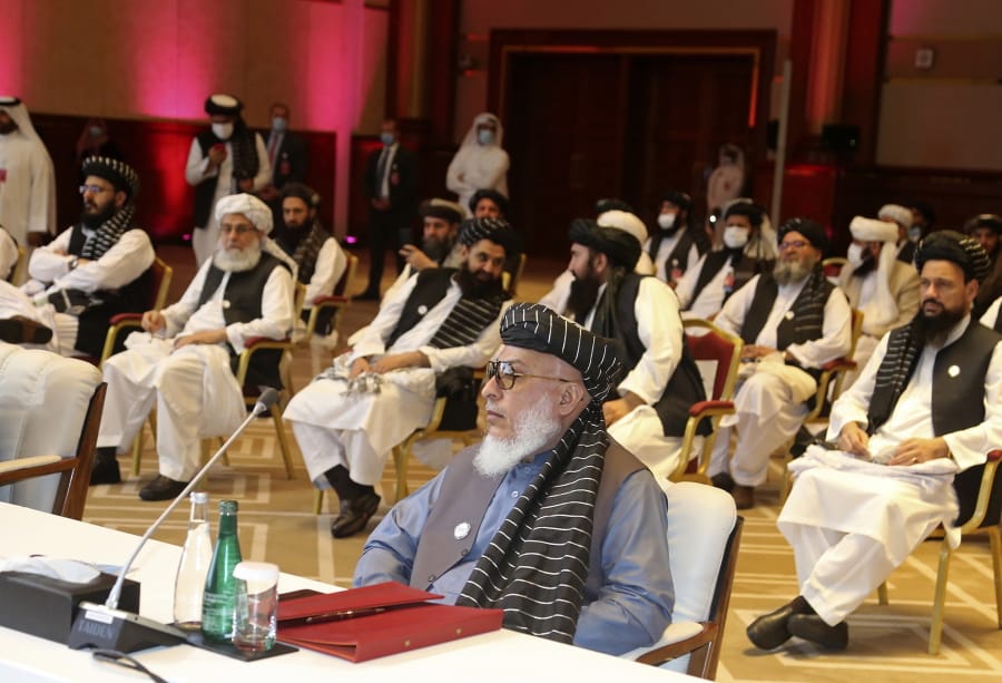 FILE - In this Sept. 12, 2020, file photo, Taliban negotiator Abbas Stanikzai, center front, and his delegation attend the opening session of peace talks between the Afghan government and the Taliban, in Doha, Qatar. Afghanistan&#039;s Taliban on Thursday, Oct. 8, 2020, welcomed a tweet from President Donald Trump in which he promised to have the last of the U.S.&#039;s troops out of Afghanistan by Christmas. If that withdrawal happens, it would be months ahead of schedule and the tweet made no reference to a Taliban promise to fight terrorist groups -- a previous pre-requisite for an American withdrawal.