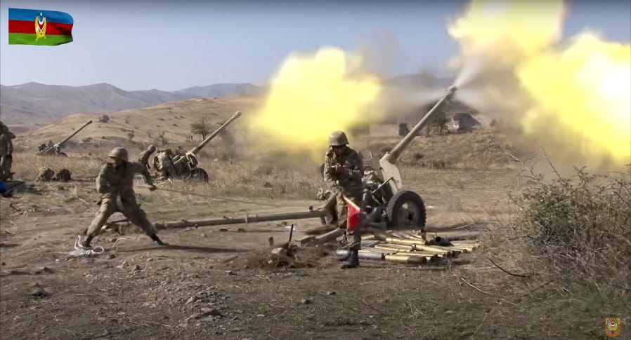 In this image taken from video released by Azerbaijan&#039;s Defense Ministry on Tuesday, Oct. 20, 2020, Azerbaijan army soldiers fire an artillery piece during fighting with forces of the self-proclaimed Republic of Nagorno-Karabakh. Azerbaijan Defense Ministry claims that Armenian forces tried to carry out an offensive that was met by an artillery strike from Azerbaijan, causing a large number of casualties among Armenian forces.