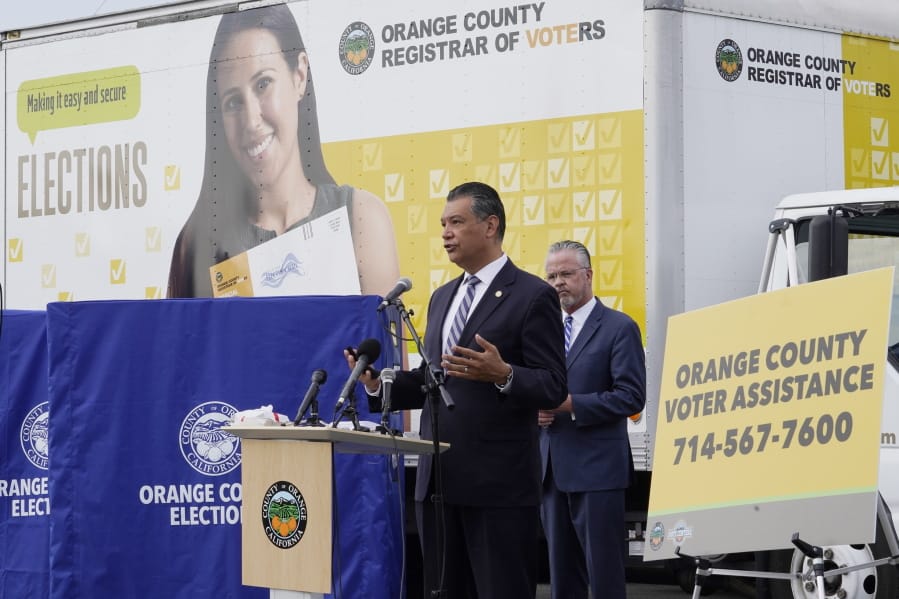 FILE - In this Oct. 5, 2020, file photo, California Secretary of State Alex Padilla, left, and Orange County Registrar of Voters Neal Kelley hold a news conference on Orange County&#039;s comprehensive plans to safeguard the election and provide transparency in Santa Ana, Calif. California election officials have received reports that unofficial ballot drop boxes were placed in several counties and said these set-ups are illegal. The Orange County Register reports Monday, Oct. 12, 2020, that Secretary of State spokesman Sam Mahood said boxes were reported in Fresno, Los Angeles and Orange counties at locations including political party offices, candidate headquarters and churches. He said the state was looking into the origin of the boxes.
