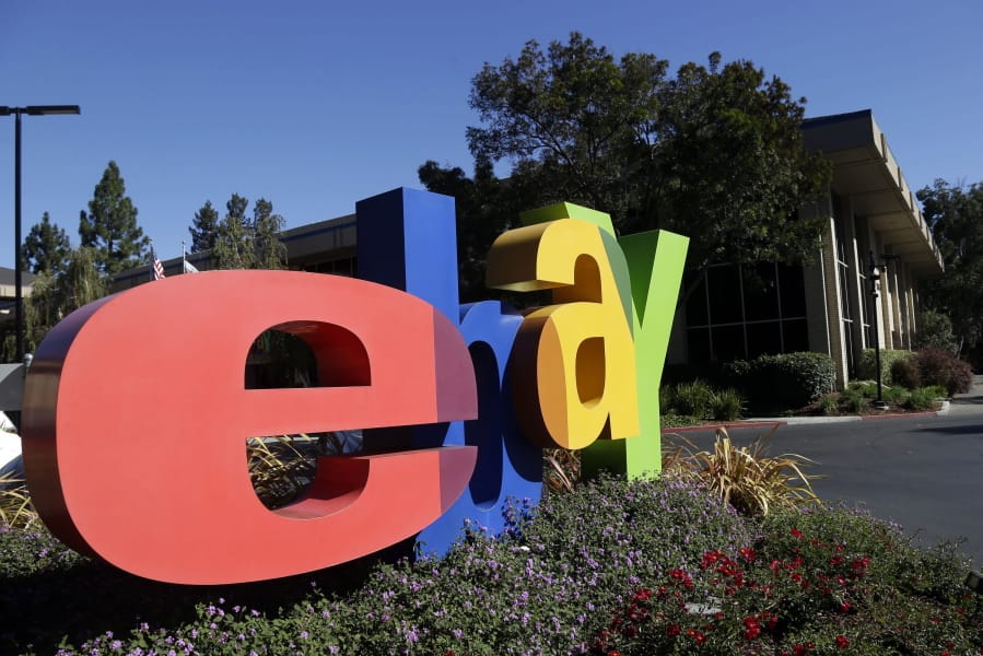 FILE - In this Oct. 17, 2012, file photo, an eBay sign sits in front of the company&#039;s headquarters in San Jose, Calif. On Wednesday, Sept. 23, 2020, federal prosecutors said four former eBay Inc. employees had agreed to plead guilty to their roles in a campaign of intimidation that included sending live spiders and cockroaches to the home of a Massachusetts couple who ran an online newsletter highly critical of the auction site.
