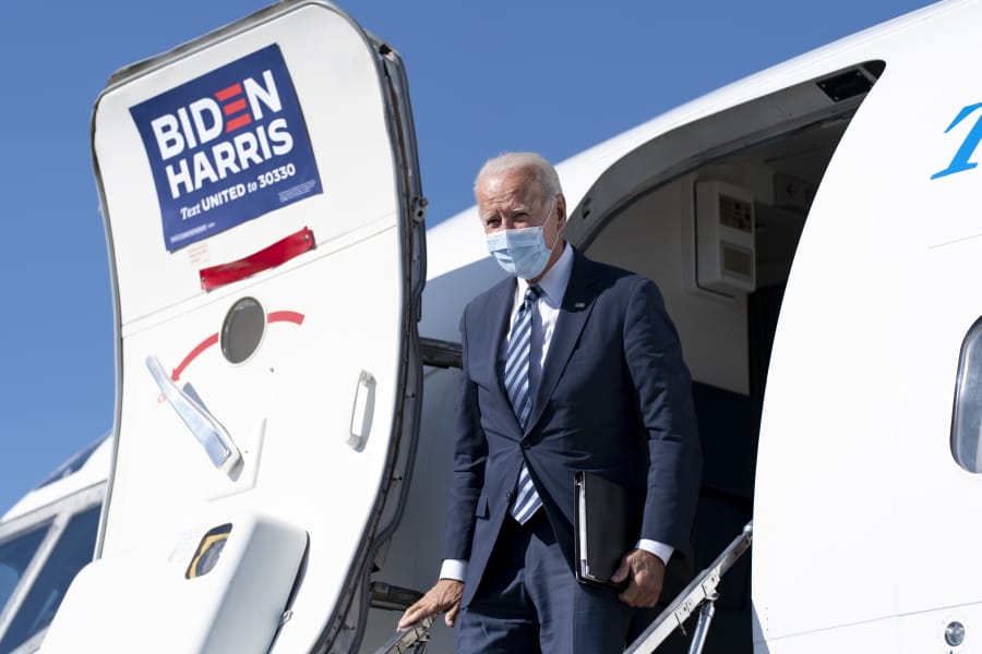 FILE - In this Oct. 6, 2020, file photo Democratic presidential candidate former Vice President Joe Biden arrives at Hagerstown Regional Airport in Hagerstown, Md., to travel to Gettysburg, Pa. Biden and his running mate, California Sen. Kamala Harris, were scheduled to visit the Phoenix area on Thursday, Oct. 8, campaigning together for the first time since the Democratic convention.