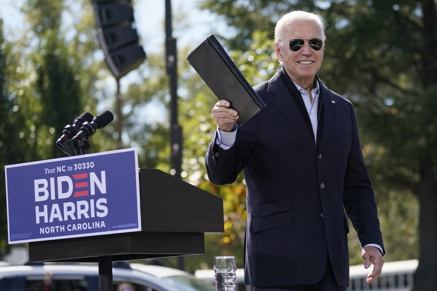 Democratic presidential candidate former Vice President Joe Biden turns from the podium after speaking during a campaign event at Riverside High School in Durham, N.C., Sunday, Oct. 18, 2020.
