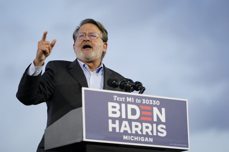 Sen. Gary Peters, D-Mich., speaks during an event for Democratic presidential candidate former Vice President Joe Biden at Michigan State Fairgrounds in Novi, Mich., Friday, Oct. 16, 2020.