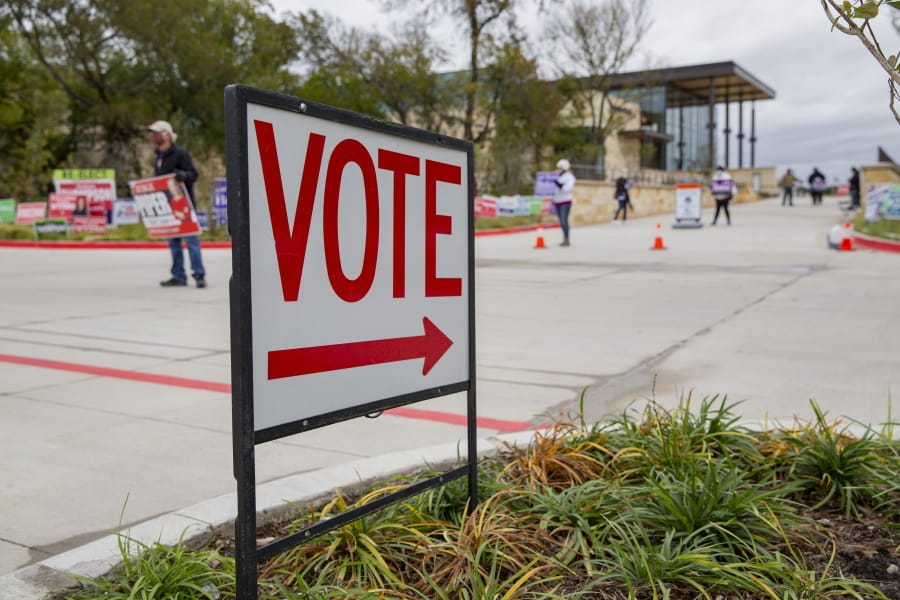 A sign directs people to an early voting poll at the Collin College campus in Wylie, Texas on Thursday, Oct. 29, 2020.