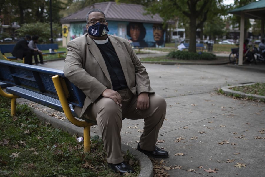 Bishop Duane Royster sits on a bench in a park in Philadelphia on Wednesday, Oct. 28, 2020. Royster is the interim executive director of POWER Interfaith, a group of religious leaders from more than 50 congregations in Pennsylvania that focuses on social justice issues, and has been active in the community following the police shooting death of Walter Wallace, Jr.