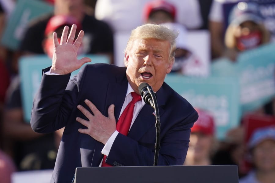 President Donald Trump gestures as he talks about Democratic presidential candidate former Vice President Joe Biden as he speaks at a campaign rally Monday, Oct. 19, 2020, in Tucson, Ariz. (AP Photo/Ross D.