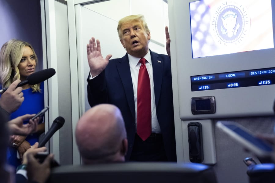 President Donald Trump talks with reporters on Air Force One after participating in the final presidential debate, Thursday, Oct. 22, 2020, in Nashville, Tenn.