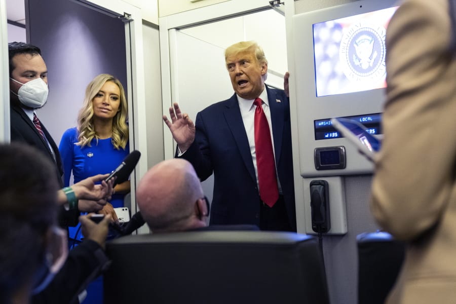 President Donald Trump talks with reporters on Air Force One after participating in the final presidential debate, Thursday, Oct. 22, 2020, in Nashville, Tenn.