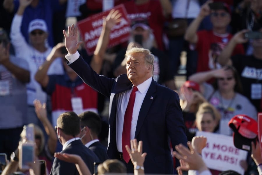 President Donald Trump waves to the crowd after speaking at a campaign rally at Phoenix Goodyear Airport Wednesday, Oct. 28, 2020, in Goodyear, Ariz. (AP Photo/Ross D.