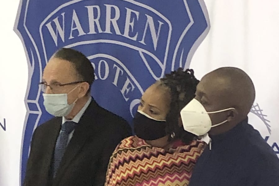 Warren, Mich., Mayor James Fouts, left, stands with Candace and Eddie Hall during a news conference, Wednesday, Sept. 30, 2020, at police headquarters in Warren. A 24-year-old white man has been charged with ethnic intimidation and other counts for firing shots into the Hall&#039;s home just north of Detroit after the family put a Black Lives Matter sign in their front window.
