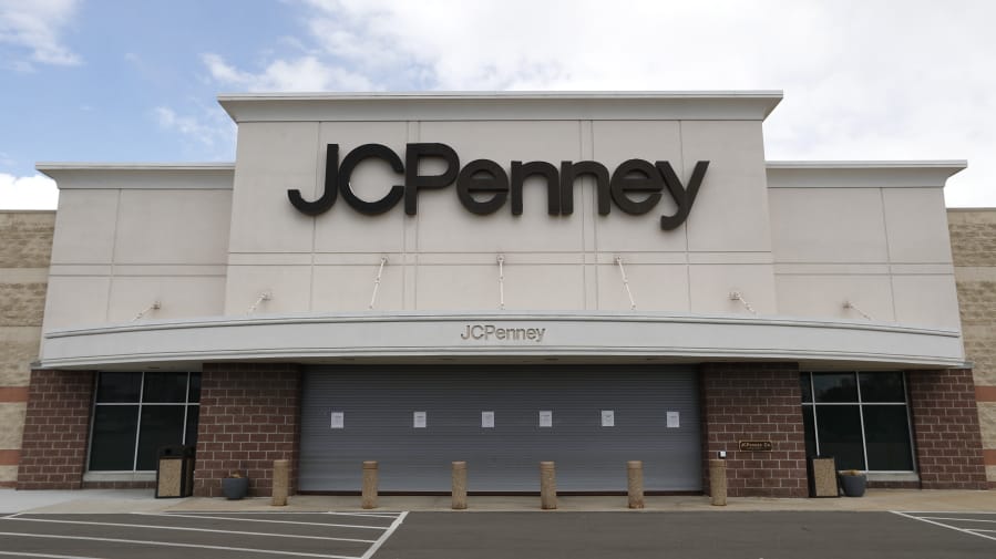 FILE - In this May 8, 2020 file photo, a parking lot at a JC Penney store is empty in Roseville, Mich.  J.C. Penney anticipates being out of bankruptcy protection before the December holiday season. The retailer said Wednesday, Oct. 21 that it filed a draft asset purchase agreement under which mall owners Brookfield Asset Management Inc. and Simon Property Group will acquire substantially all of its retail and operating assets through a combination of cash and new term loan debt.