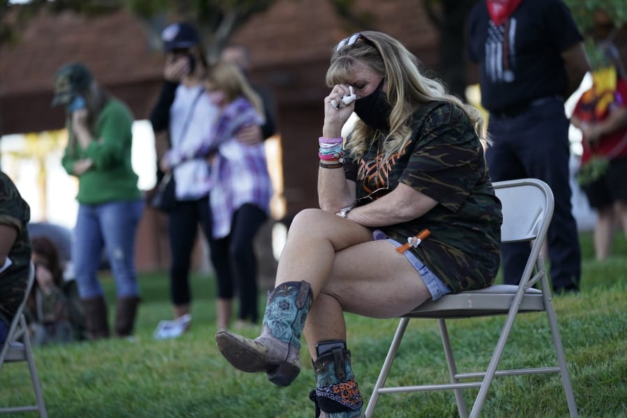 An unidentified woman cries during a ceremony Thursday, Oct. 1, 2020, on the anniversary of the mass shooting three years earlier in Las Vegas. The ceremony was held for survivors and victim&#039;s families of the deadliest mass shooting in modern U.S. history.