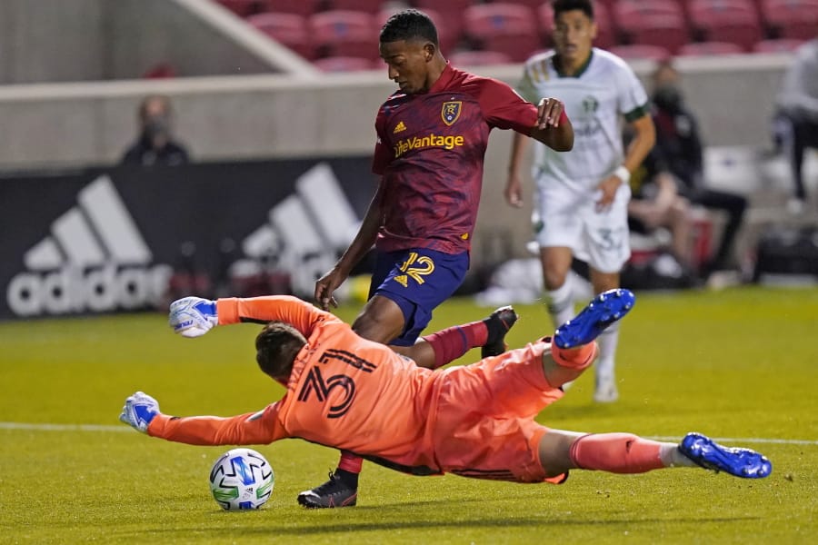 Portland Timbers goalkeeper Aljaz Ivacic (31) makes a save against Real Salt Lake in the first half of an MLS soccer match Wednesday, Oct. 14, 2020, in Sandy, Utah.