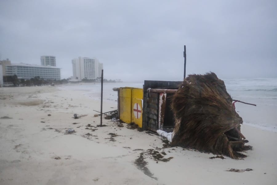 A lifeguard tower lays on its side after it was toppled over by Hurricane Delta in Cancun, Mexico, early Wednesday, Oct. 7, 2020. Hurricane Delta made landfall Wednesday just south of the Mexican resort of Cancun as a Category 2 storm, downing trees and knocking out power to some resorts along the northeastern coast of the Yucatan Peninsula.