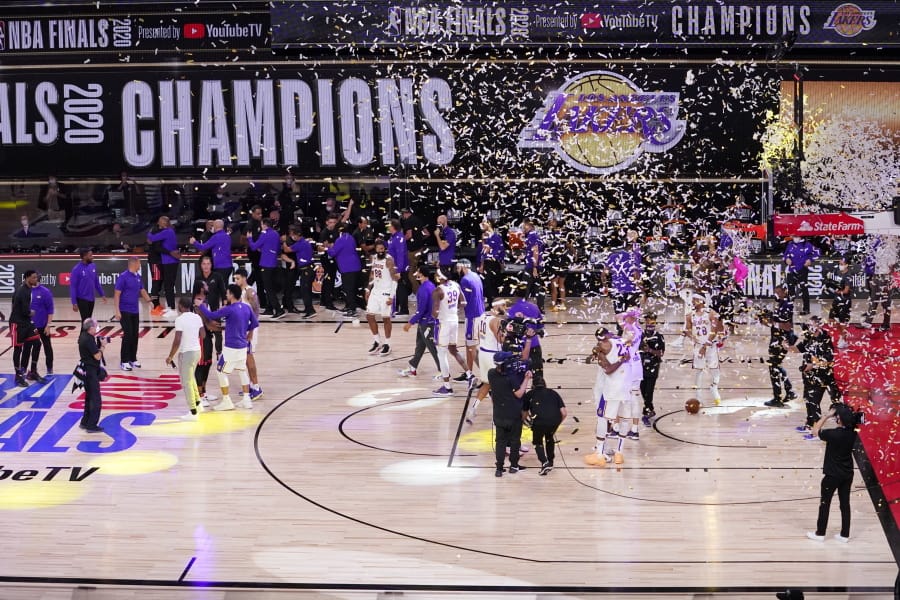 The Los Angeles Lakers players celebrate after the Lakers defeated the Miami Heat 106-93 in Game 6 of basketball&#039;s NBA Finals Sunday, Oct. 11, 2020, in Lake Buena Vista, Fla. (AP Photo/Mark J.