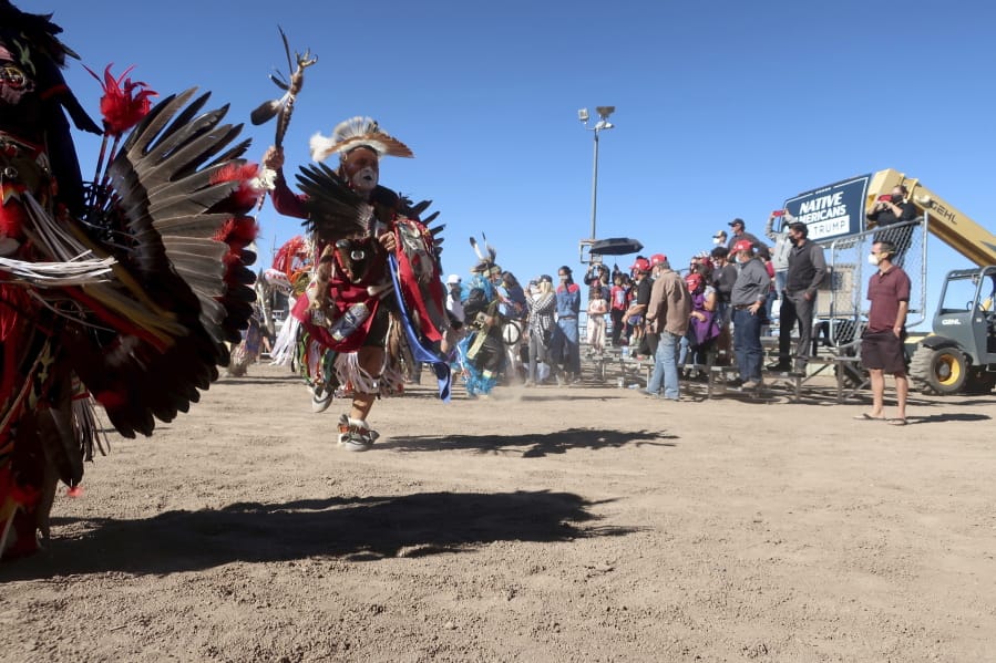 Native American dancers perform at a Donald Trump rally Oct. 15, 2020 at the rodeo grounds in Williams, Arizona. Navajo Nation President Myron Lizer makes no qualms about it: As one of the top officials on the country&#039;s largest Native American reservation, he&#039;s a proud Donald Trump supporter. Lizer says Native American values - hard work, family and ranching - align more with the GOP than with Democrats.
