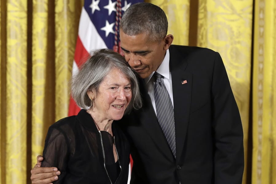 FILE - In this Thursday, Sept. 22, 2016 file photo, President Barack Obama embraces poet Louise Gluck before awarding her the 2015 National Humanities Medal during a ceremony in the East Room of the White House, in Washington. The 2020 Nobel Prize for literature has been awarded to American poet Louise Gluck &quot;for her unmistakable poetic voice that with austere beauty makes individual existence universal.&quot; The prize was announced Thursday Oct. 8, 2020 in Stockholm by Mats Malm, the permanent secretary of the Swedish Academy.