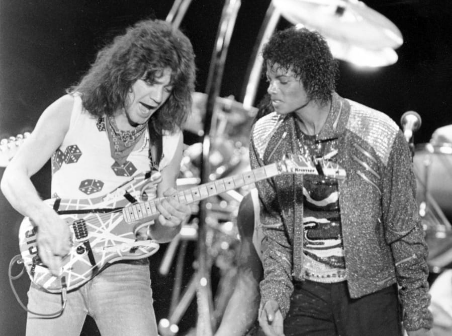Van Halen guitarist Eddie Van Halen, left, performs &quot;Beat It&quot; with Michael Jackson during Jackson&#039;s Victory Tour concert in Irving, Texas, in 1984.