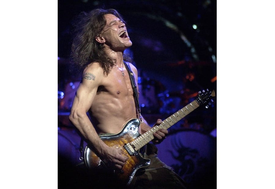 FILE - In this Aug. 5, 2004 file photo, Van Halen guitarist Eddie Van Halen performs in Phoenix. Van Halen, who had battled mouth cancer, died Tuesday, Oct. 6, 2020. He was 65.