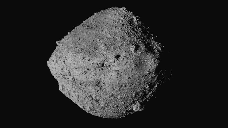 This undated image made available by NASA shows the asteroid Bennu from the OSIRIS-REx spacecraft. After almost two years circling the ancient asteroid, OSIRIS-REx will attempt to descend to the treacherous, boulder-packed surface and snatch a handful of rubble on Tuesday, Oct. 20, 2020.