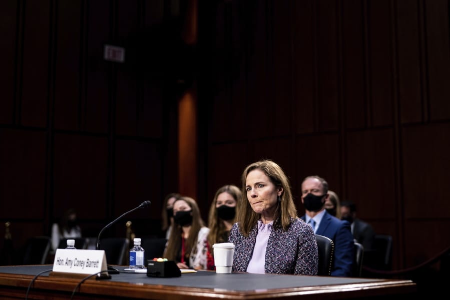 FILE - In this Oct. 14, 2020, file photo, Supreme Court nominee Amy Coney Barrett listens during a confirmation hearing before the Senate Judiciary Committee on Capitol Hill in Washington. Barrett served for nearly three years on the board of a private Christian school that effectively barred admission to children of same-sex parents and made it plain openly gay and lesbian teachers weren&#039;t welcome in the classroom.