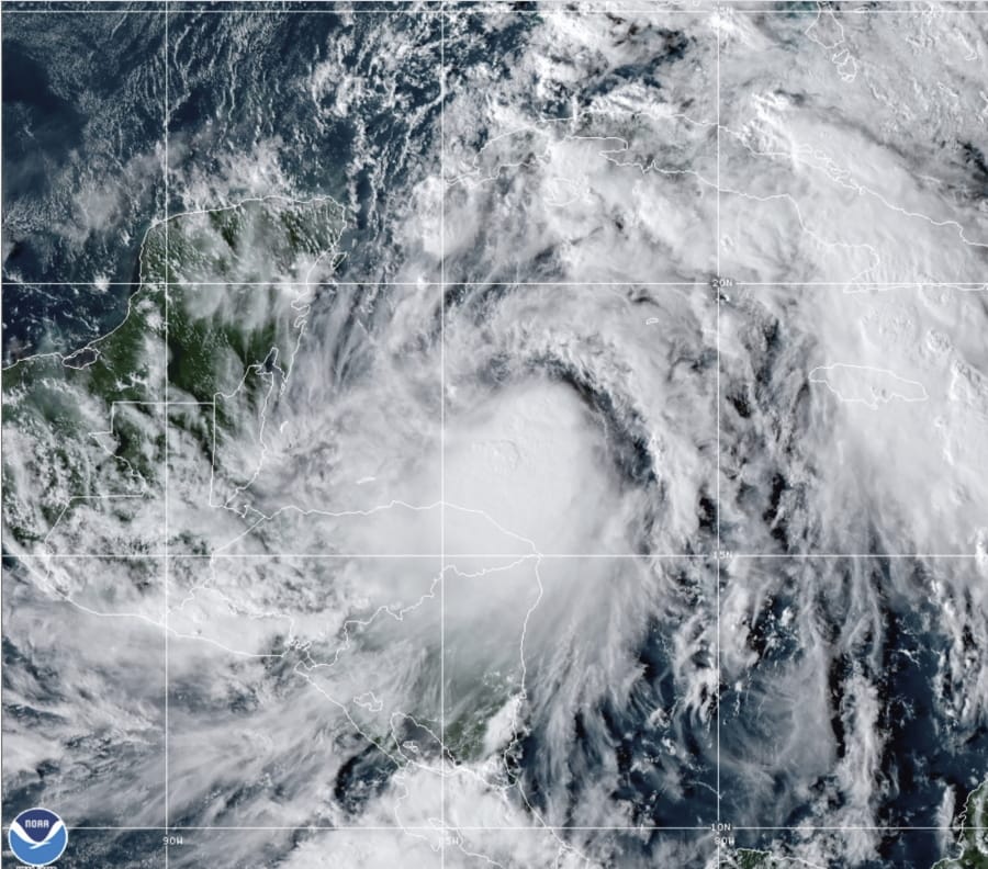 This satellite image provided by the National Oceanic and Atmospheric Administration shows Tropical Storm Zeta, Sunday, Oct. 25, 2020, at 2110 GMT (5:10 p.m. ET).