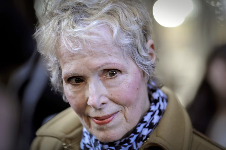 FILE - In this March 4, 2020, photo, E. Jean Carroll talks to reporters outside a courthouse in New York. The U.S. Justice Department is seeking to take over President Donald Trump&#039;s defense in a defamation lawsuit brought by Carroll, who accused the president of raping her in a New York luxury department store in the mid-1990s. Federal lawyers asked a court Tuesday, Sept. 8, 2020, to allow a legal move that could put the American people on the hook for any money she might be awarded. She says the president&#039;s comments, including that she was &quot;totally lying&quot; to sell a memoir, besmirched her character and harmed her career when he denied the rape allegations in 2019.