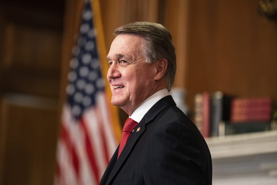 Sen. David Perdue, R-Ga., meets with Judge Amy Coney Barrett, President Donald Trumps nominee for the U.S. Supreme Court, not pictured, on Capitol Hill in Washington, Wednesday, Sept. 30, 2020.