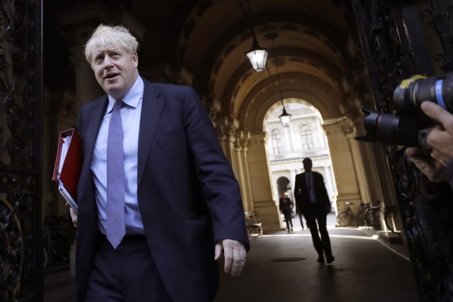Britain&#039;s Prime Minister Boris Johnson returns to Downing Street after attending a Cabinet meeting in London, Tuesday, Oct. 20, 2020.