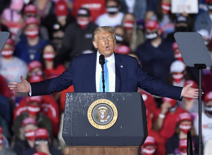 In this Sept. 26, 2020, file photo, President Donald Trump speaks during a campaign rally at Harrisburg International Airport in Middletown, Pa. President Trump and first lady Melania Trump have tested positive for the coronavirus, the president tweeted early Friday.