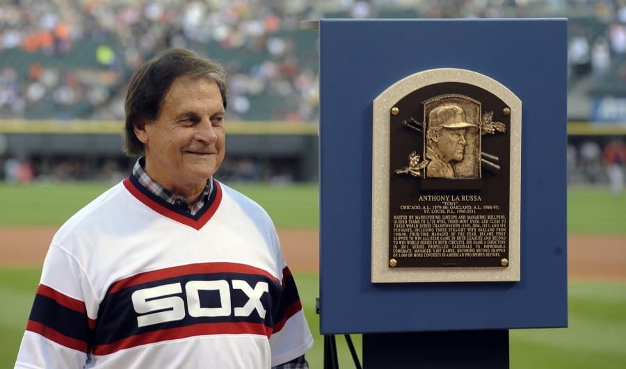 Former Chicago White Sox manager Tony La Russa stands with his Baseball Hall of Fame plaque in 2014 in Chicago. La Russa, the Hall of Famer who won a World Series championship with the Oakland Athletics and two more with the St. Louis Cardinals, is returning to manage the Chicago White Sox 34 years after they fired him, the team announced Thursday, Oct. 29, 2020.