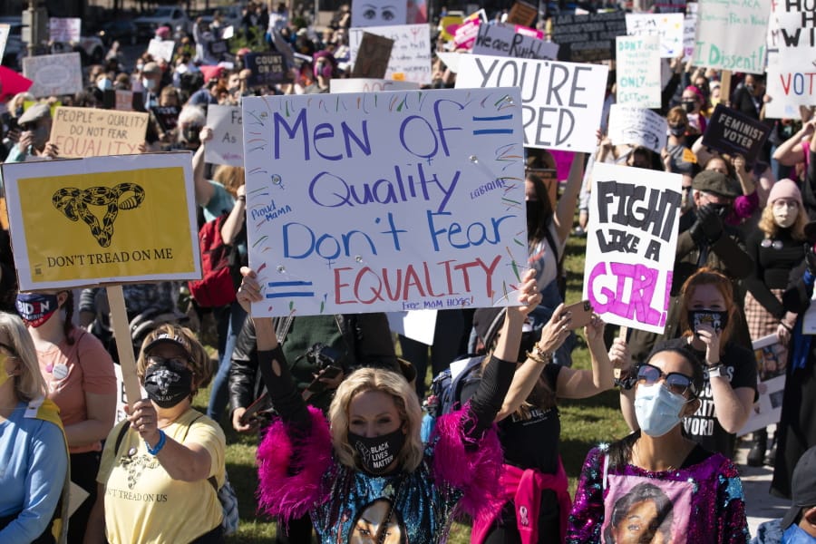 Protestors rally during the Women&#039;s March at Freedom Plaza, Saturday, Oct. 17, 2020, in Washington.