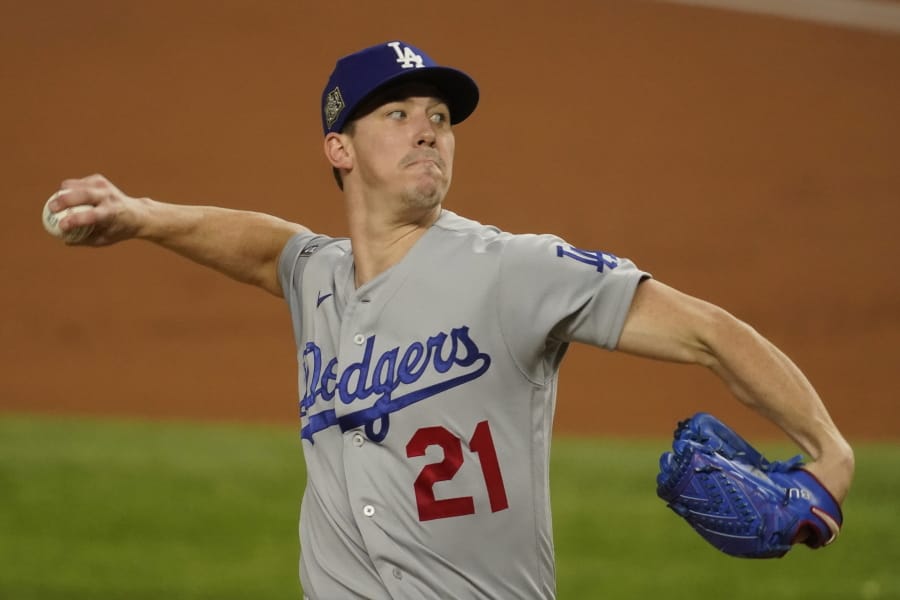 Los Angeles Dodgers starting pitcher Walker Buehler throws against the Tampa Bay Rays during the first inning in Game 3 of the baseball World Series Friday, Oct. 23, 2020, in Arlington, Texas.