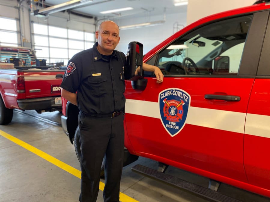 Clark County Fire &amp; Rescue announced Friday that it is changing its name to Clark-Cowlitz Fire Rescue. Decals reflecting the change are already on some of the district&#039;s vehicles, such as this one next to Chief John Nohr.