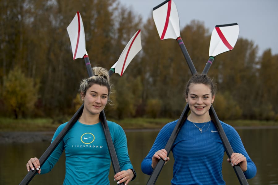 Rowers Kate Feustel, left, and Lauren Coop pause for a portrait at Vancouver Lake on Tuesday morning, Nov. 10, 2020.