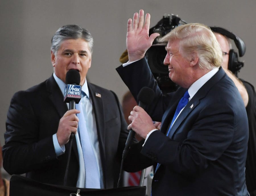Fox News Channel and radio talk show host Sean Hannity, left, interviews President Donald Trump before a campaign rally at the Las Vegas Convention Center on September 20, 2018, in Las Vegas.
