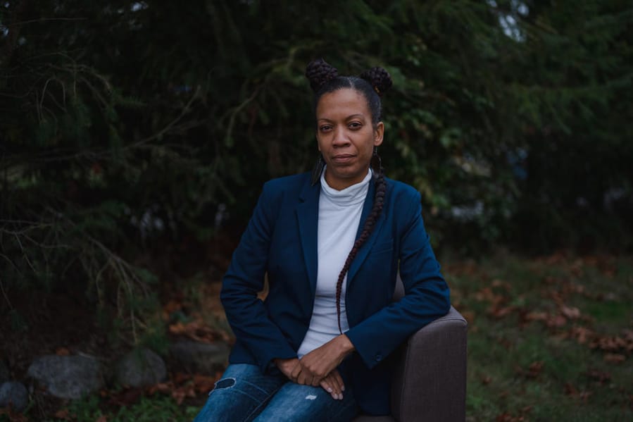 Shukura Wilford on Wednesday, Nov. 11, 2020, outside her home in Renton, Wash. Wilford, a single mother of three who works for Seattle Public Schools, is struggling to pay her rent.