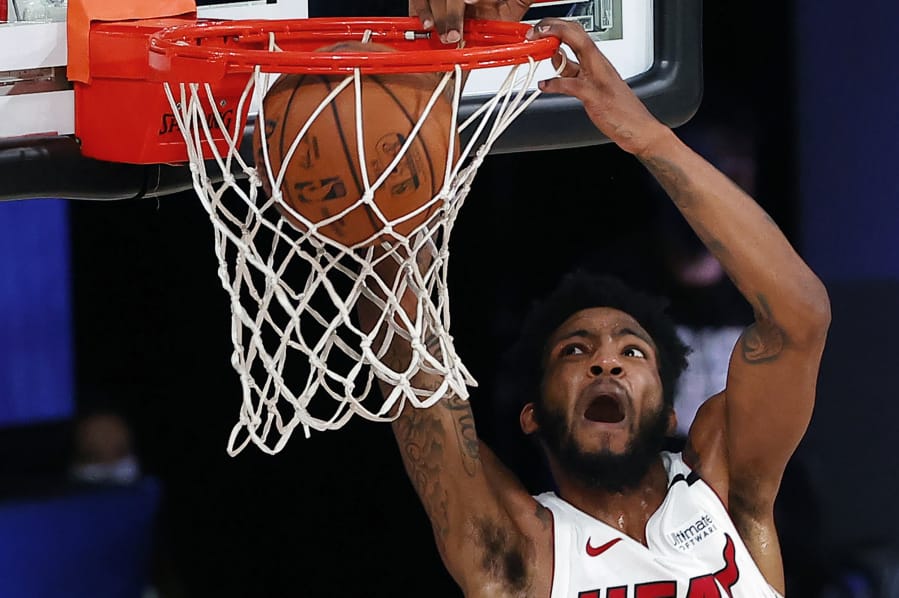 Miami Heat&#039;s Derrick Jones Jr. dunks against the Oklahoma City Thunder during the second half of an NBA basketball game Wednesday, Aug. 12, 2020, in Lake Buena Vista, Fla. (Kevin C.