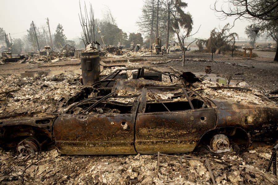 A neighborhood destroyed by fire is seen as wildfires devastate the region, Friday, Sept. 11, 2020 in Talent, Ore.